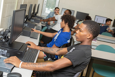 Christine sitting at table with a student