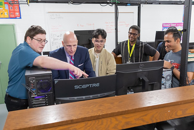 Students show John J. “Ski” Sygielski, MBA, Ed.D., president and CEO of HACC, some of the upgraded equipment in the computer hardware lab.